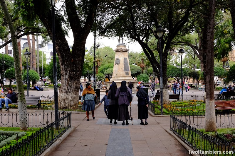 City square, nuns meeting lady in traditional Bolivian clothes