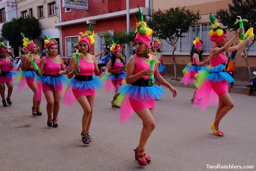 Women dressed up in fruity costumes, cocktails in their hands