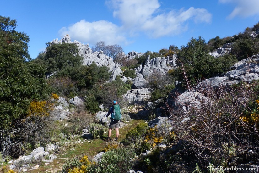 Hiker on a trail between rocks, Andalucía