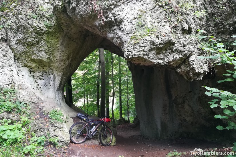 packed bike against hole in rock