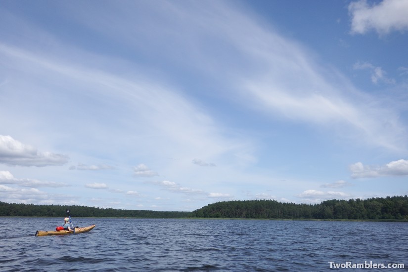 kayak on lake, blue sky